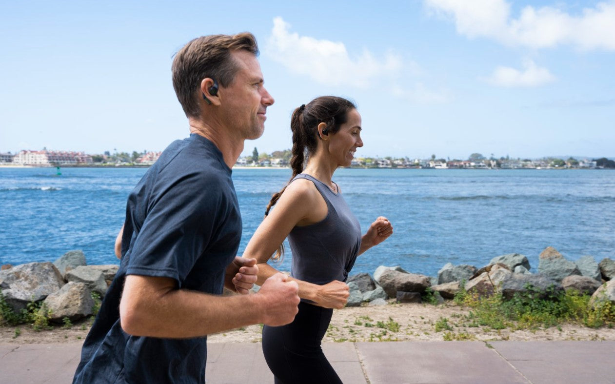 Man and woman running while wearing Epic Open Sport